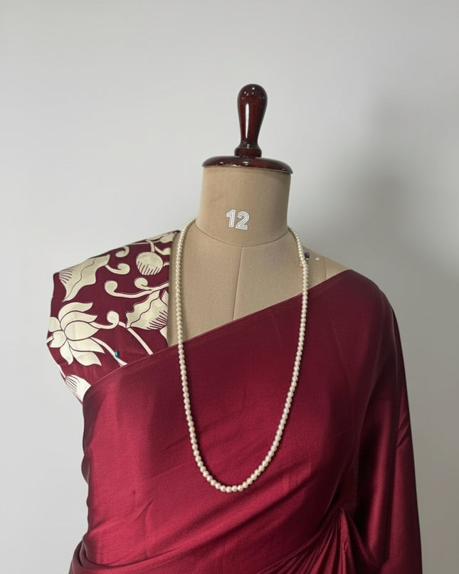 Maroon kalamkari print modal satin crepe saree