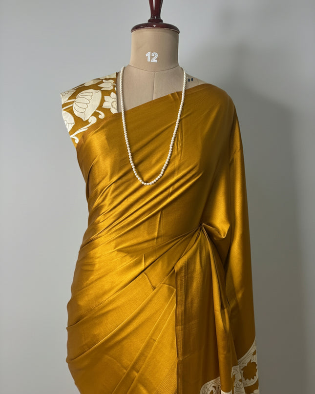 Dark mustard yellow kalamkari print modal satin crepe saree