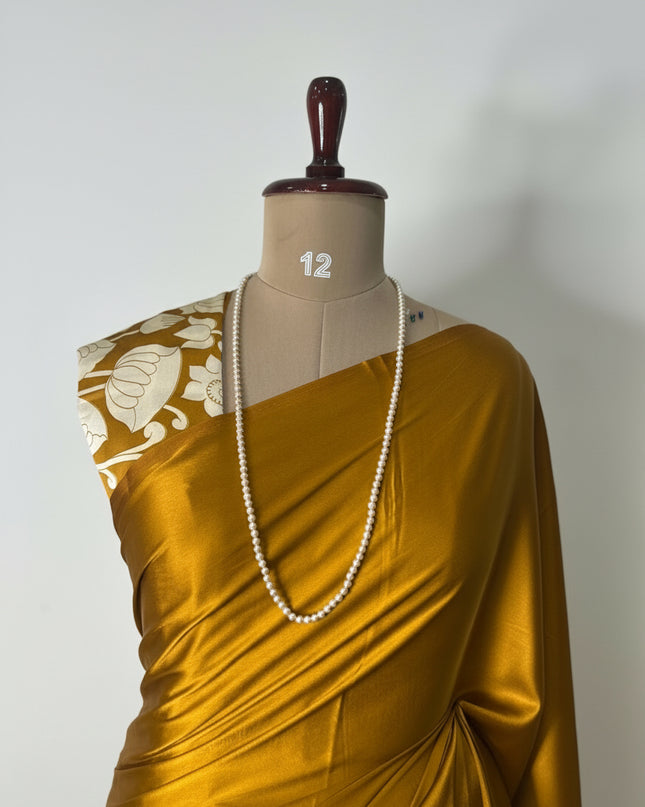 Dark mustard yellow kalamkari print modal satin crepe saree