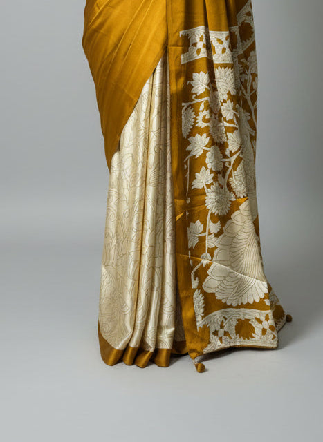 Dark mustard yellow kalamkari print modal satin crepe saree